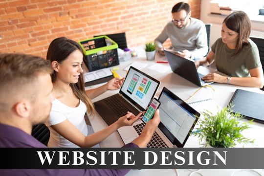 A team of professionals collaborating on website design, featuring laptops and mobile devices displaying layout designs, with the text "Website Design" displayed prominently below.